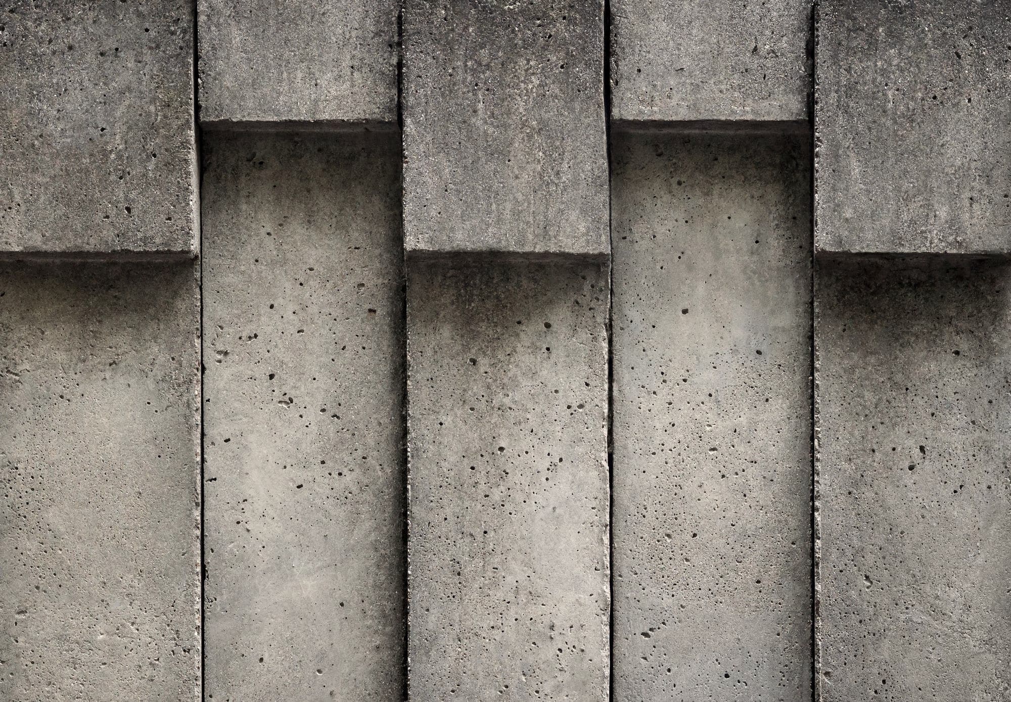 Concrete wall cast in deep vertical relief
